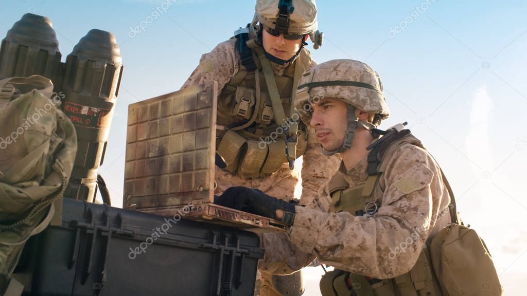 Soldiers are Using Laptop Computer for Surveillance During Milit