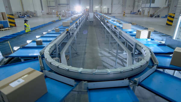 Time-Lapse of Working Large Belt Conveyor with Parcels at Sortin