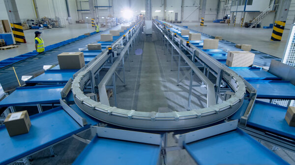 Time-Lapse of Working Large Belt Conveyor with Parcels at Sortin