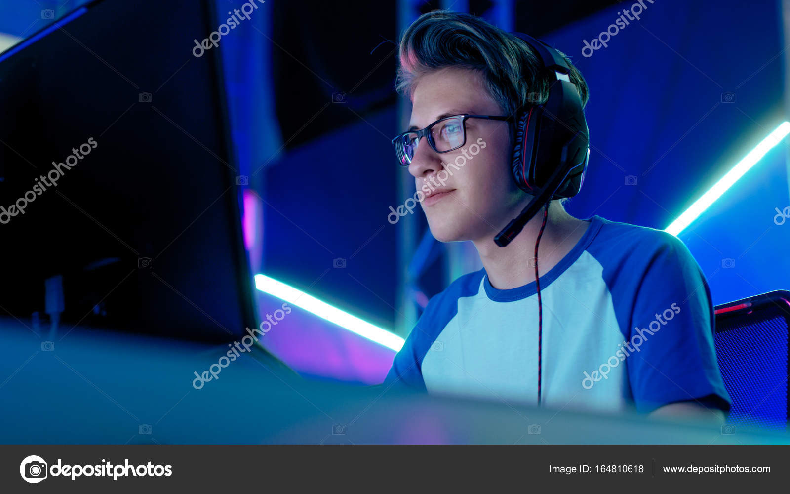 Young Gamer Headset Plays Virtual Online Video Game Using Wireless Stock  Photo by ©EvgeniyShkolenko 664461506