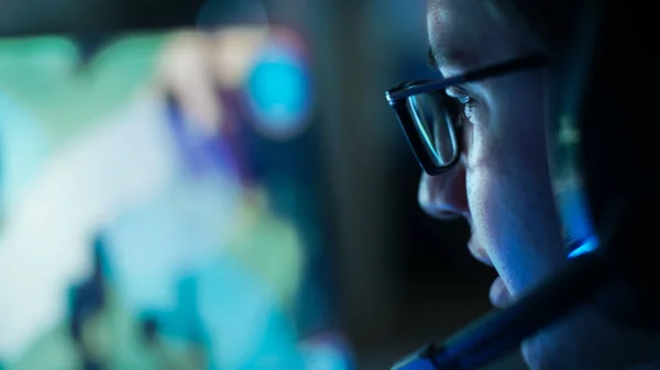 Close-up Shot of Professional Gamer Plays in MMORPG/ Strategy Video Game on His Computer. He's Participating in Online Cyber Games Tournament, Plays at Home, or in Internet Cafe. He Wears Glasses and Gaming Headsets. — Stock Photo, Image