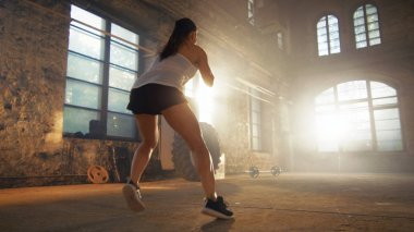 Fit Athletic Woman Does Footwork Running Drill in a Deserted Fac clipart