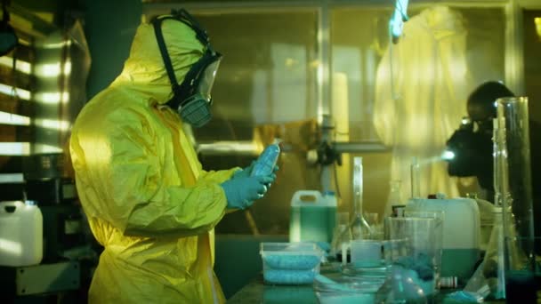 Fully Armed Special Anti-Narcotics Task Forces Soldier Arrests Clandestine Chemist in the Drug Producing Underground Laboratory. Chemist Raises Hands and Surrenders. A lot of Functional Drug Production Equipment is Standing Around. Shot in Slow Motio — Stock Video