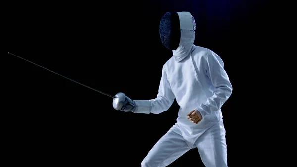 One Professional Fencer is Standing Ready for Fighting. Shot Isolated on Black Background with Cold Tones. — Stock Photo, Image