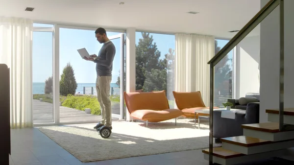 Tech Industry Businessman Working From Home Uses Laptop Computer