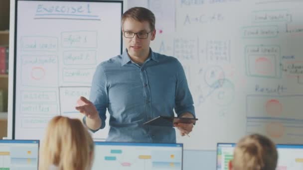 Elementary School Class: Teacher Uses Interactive Digital Whiteboard, Explains Lesson to Diverse Group of Smart Children. Kids getting Modern Education, Learn Computer Science, Software Programming — Stock Video