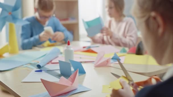 Elementary School Arts & Crafts Class: Diverse Group of Smart Children Have Fun on a Handicraft Project, Using Colorful Paper, Sax and Glue to Create Fun Papier Mache. Bågkamera Skott — Stockvideo