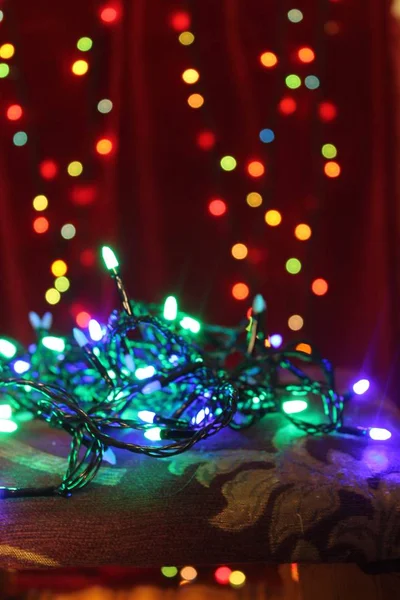 Christmas garland sparkles on a Christmas background.