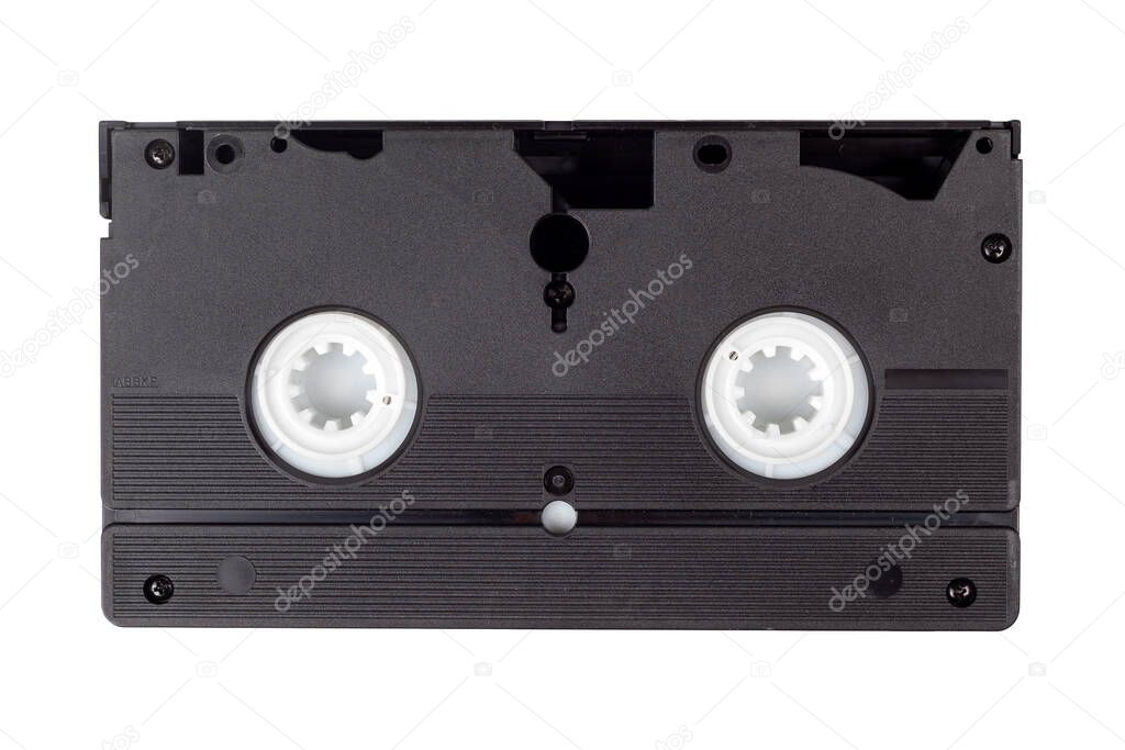 Single old vintage black blank VHS video cassette isolated on white, back side. Retro technology, vcr, outdated obsolete vhs tape, tech items from the 80s and 90s. One videotape on white, hq closeup