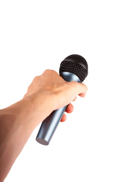 一只手把一个简单的无线话筒从被白色隔离的观众席上伸出来 向某人发出声音 大声说话 发表公开演讲 把话筒递给说话者 伸出手来 的概念 — 图库照片