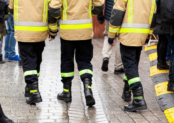 Three Anonymous Fireman Yellow Reflective Uniforms Black Boots Trousers Walking — Stock Photo, Image