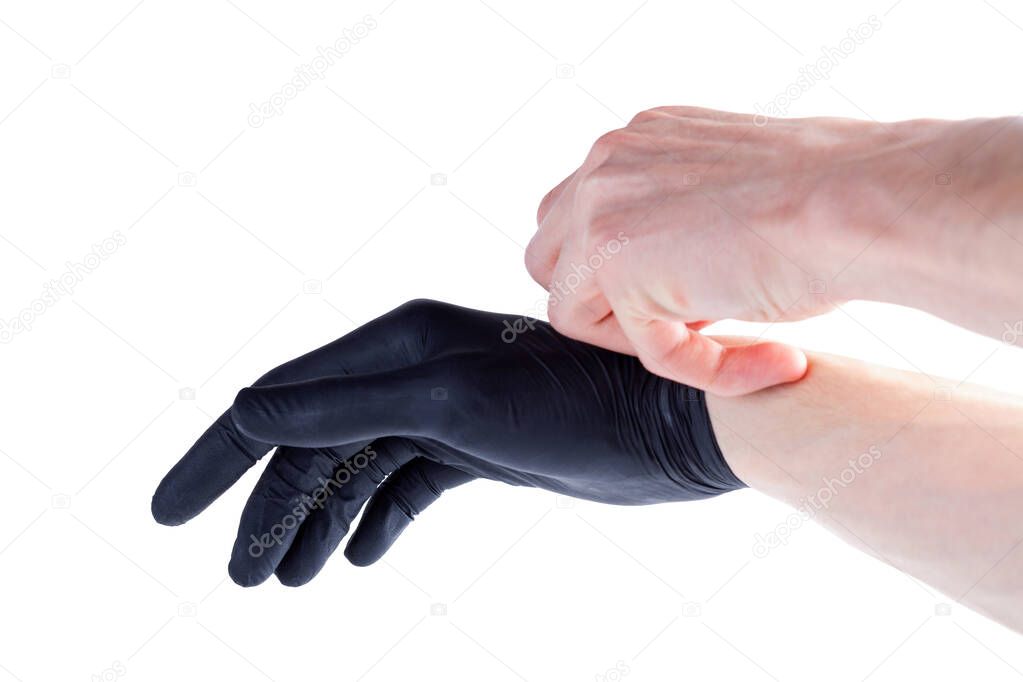 Man safely removing, taking off black protective disposable medical rubber gloves hand gesture, isolated on white, cut out, closeup. Safety, hygienic removal, disposal of one time use latex gloves