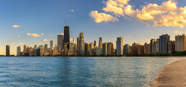 Chicago skyline panorama across Lake Michigan at sunset viewed from North Avenue Beach