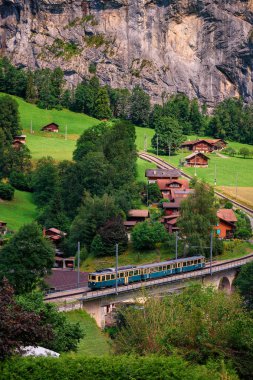 Vintage train in the Lauterbrunnen valley, Switzerland clipart