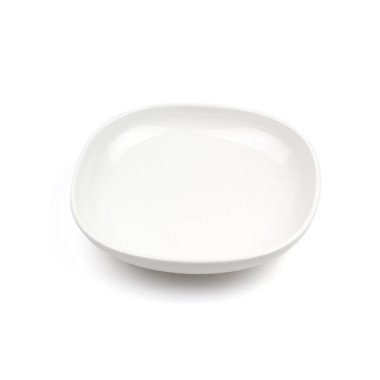 Beyaz zemin üzerinde beyaz seramik plaka.