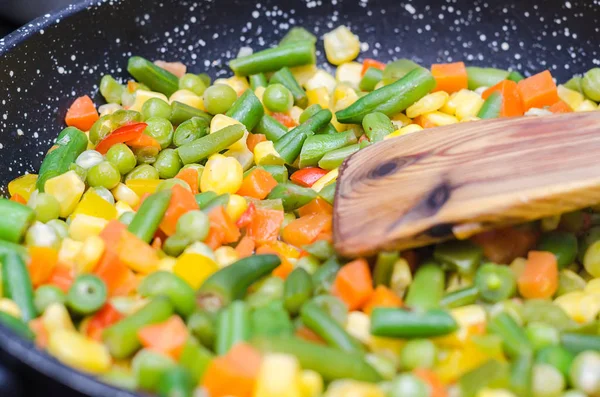 Stewed sliced vegetables in a pan Stock Image