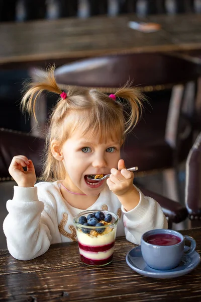 Girl Eats Dessert Table Happy Child Eats Sweets Beautiful Baby — Stock Photo, Image