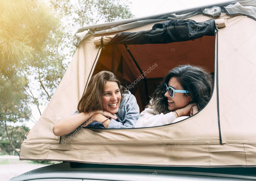Two sisters who get along do camping together and talk