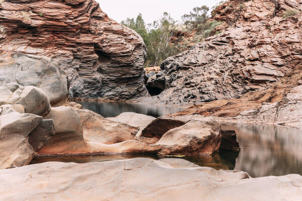 Long exposure natural pool in a amazing rocky gorge in Karijini