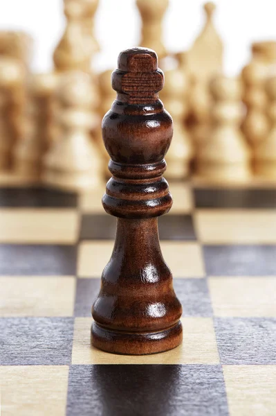 Wooden king brown chess piece black on chessboard — Stock Photo, Image