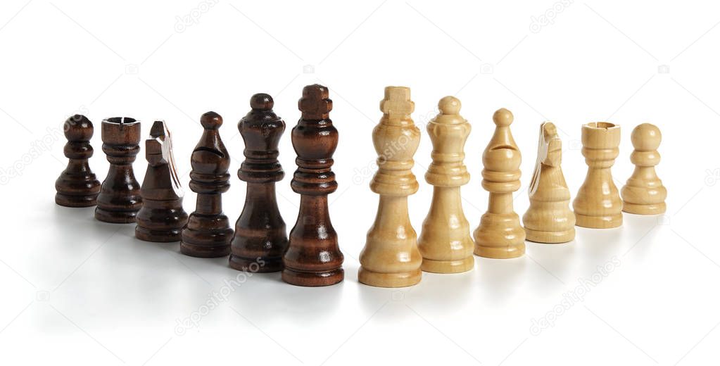 Wooden chess pieces on white background