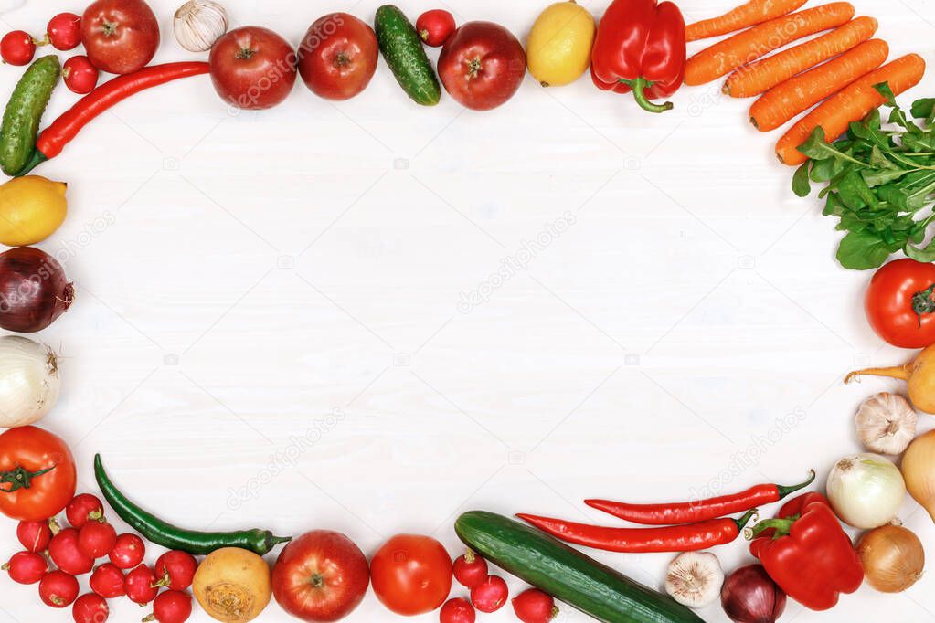 Vegetables and fruits on a white wooden table. Top view.