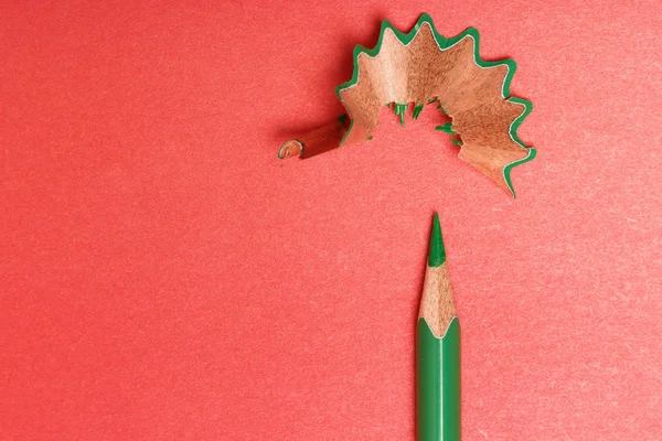 Green pencil on a red background. renovation concept — 스톡 사진