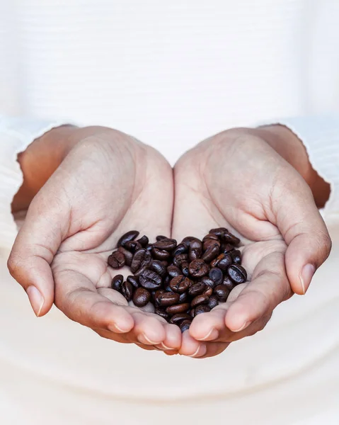Closeup coffee bean in women hands concept for good morning and — Stock Photo, Image