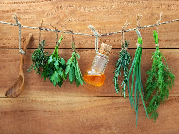 Various herbs hanging on shabby wooden background. Parsley ,sage — Stock Photo, Image