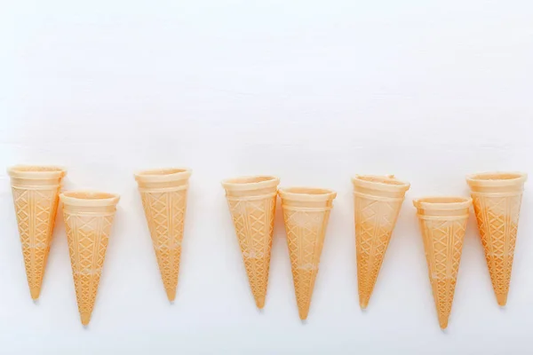 Flat lay ice cream cones collection on white wooden background . — Stock Photo, Image