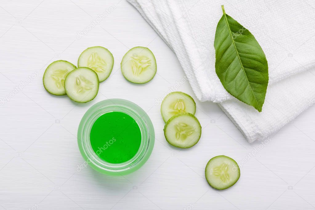 Natural herbal skin care products. Top view ingredients cucumber and aloe vera gel on table concept of the best all natural face moisturizer. Facial treatment preparation background.