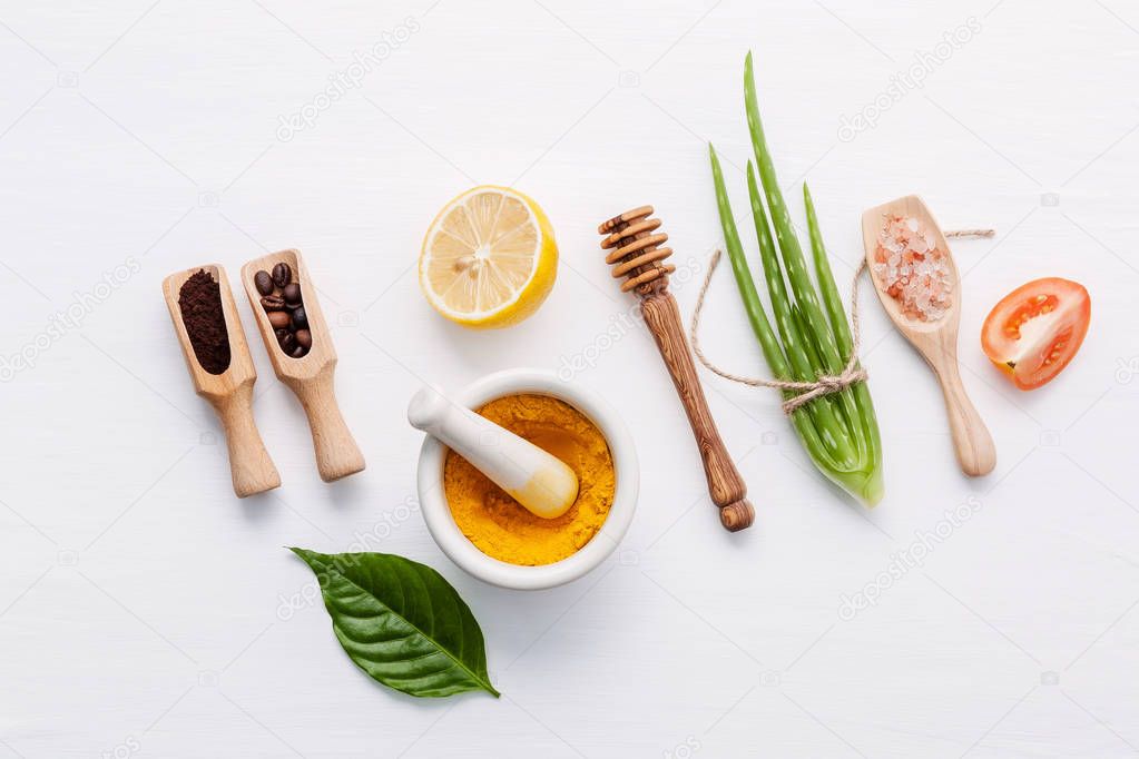 Natural herbal skin care products. Top view ingredients aloe vera ,lemon ,honey ,himalayan salt and tomato on table concept natural face moisturizer. Facial treatment preparation background.