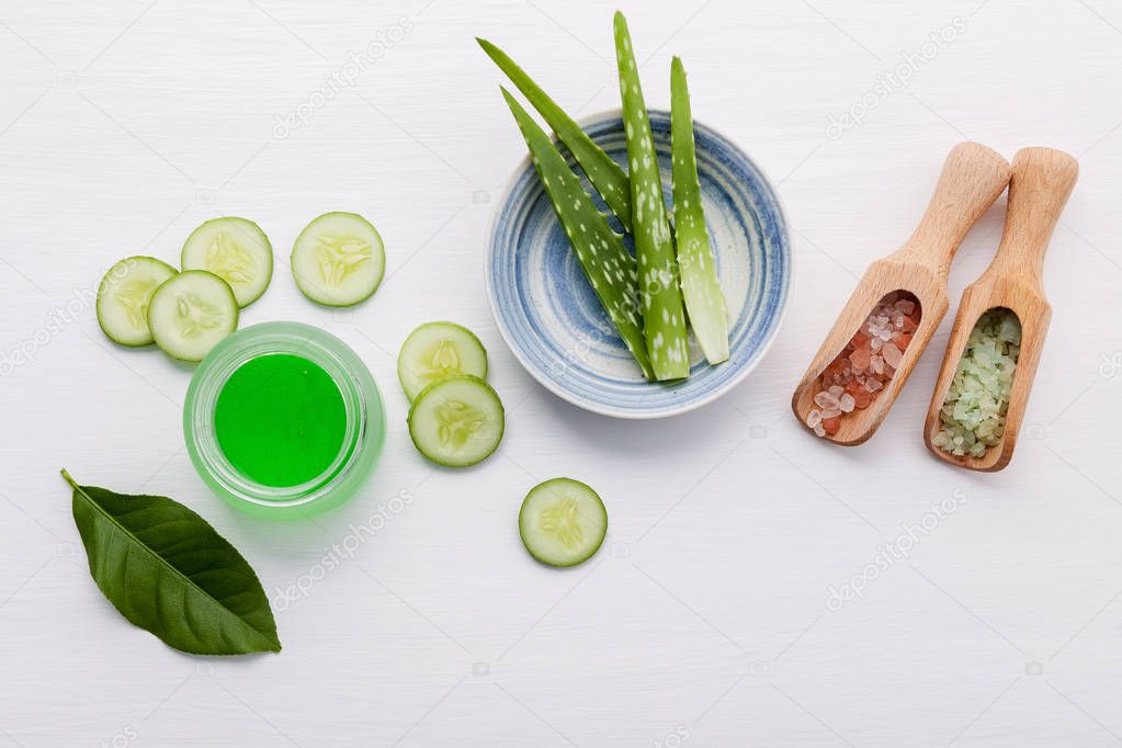 Natural herbal skin care products. Top view ingredients cucumber ,aloe vera ,lemon and himalayan salt on table concept of the best all natural face moisturizer. Facial treatment preparation background.