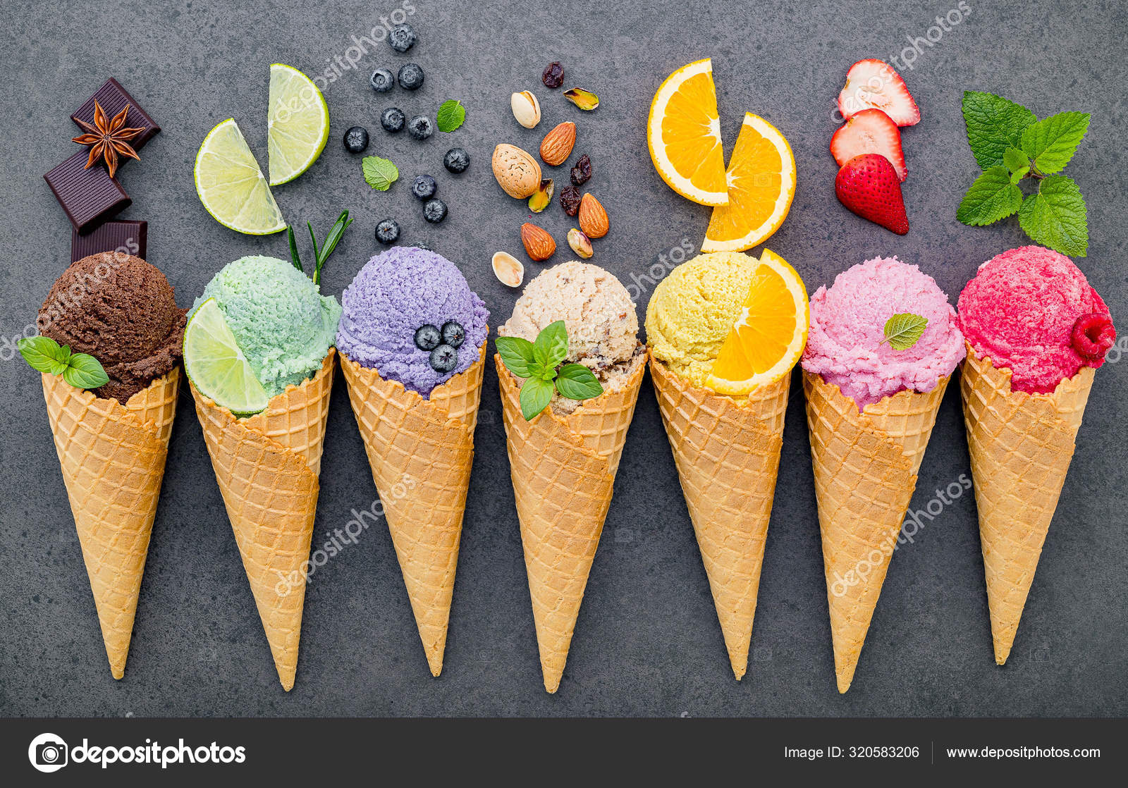 Flat lay ice cream cones collection on dark stone background . B Stock