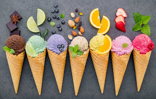 Flat lay ice cream cones collection on dark stone background . B — Stock Photo, Image