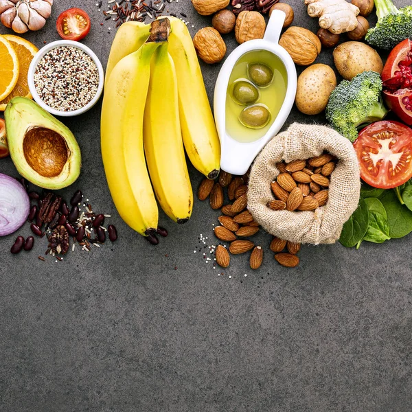 Ingredients for the healthy foods selection on dark background.