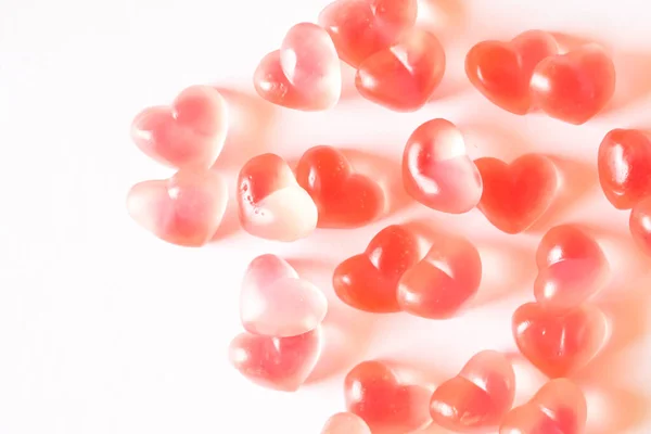 Rosa coração em forma de gomas fundo . — Fotografia de Stock