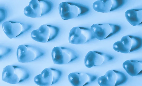 Blå hjärtformade godis mönster. — Stockfoto