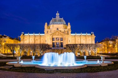 Croatia, city of Zagreb, art pavilion and fountain in the night, long exposure