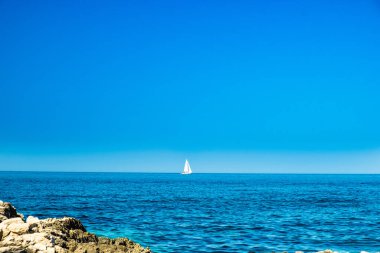 Seascape on the island of Dugi Otok archipelago in Croatia, Adriatic sea in summer, yachts on the horizon