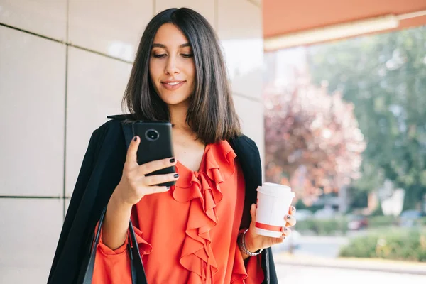 Attractive woman looking at her mobile phone