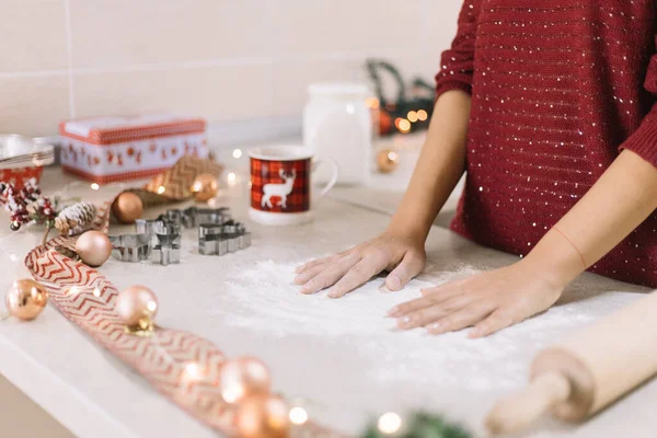 Womans hands over kitchen countertop with spilled flour