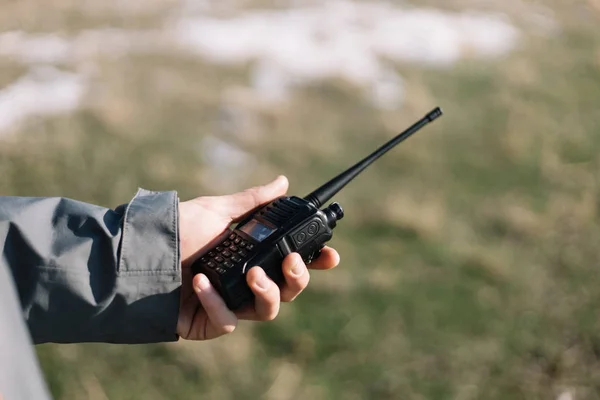 Close-up of a mans hand holding GMRS radio — Stock Photo, Image