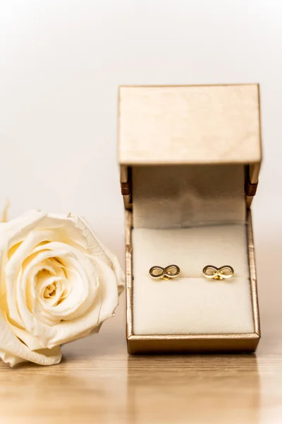 Golden earrings in box for Valentines day