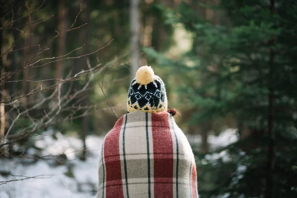 Back of a girl rolled in quilt in park — 스톡 사진