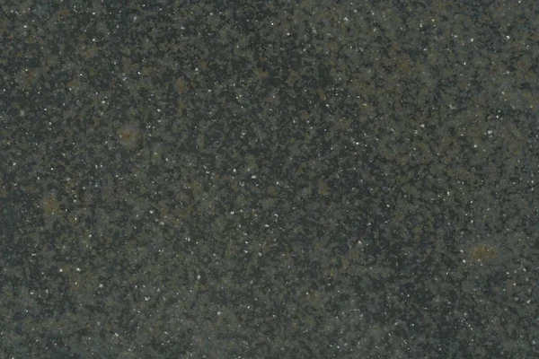 Тёмная асфальтовая текстура с контрастными точками — стоковое фото
