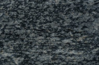 Koyu gri granit desenli beyaz benekli.