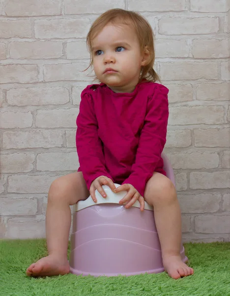 Serious Child Sitting Pot Little Girl Sits Pot Looks Away — Stock Photo, Image