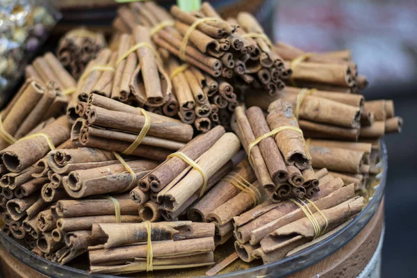 Cinnamon sticks close-up. They are wrapped with rope and sold.