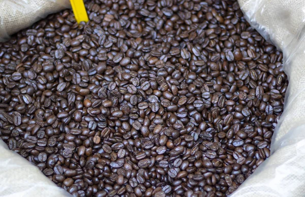 Coffee beans close-up in sack. It was photographed in front of the coffee shop.